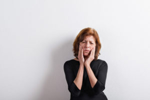 Image of adult woman suffering from tmj disorder