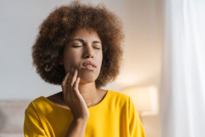 Image of a woman suffering from TMD symptoms